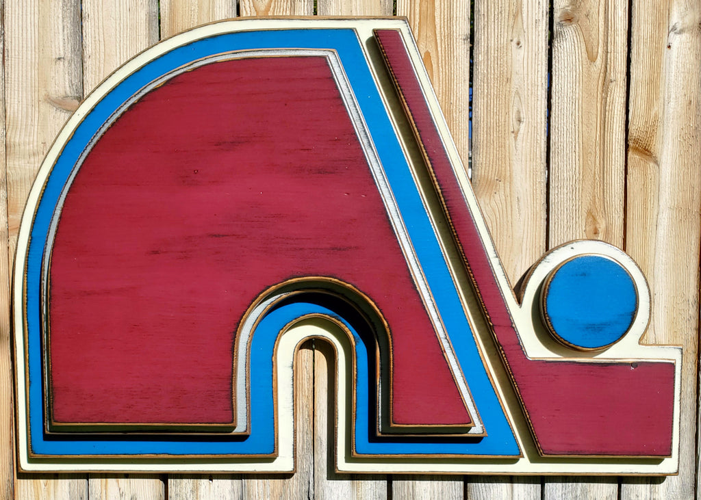 Wooden Nordique logo in 3D, painted in red, blue, and white