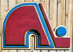Wooden Nordique logo in 3D, painted in red, blue, and white