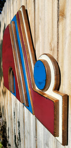 Wooden Nordique logo in 3D, painted in red, blue, and white