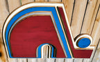 Wooden Nordique logo in 3D, painted in red, blue, and white