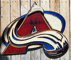 Colorful Avalanche A logo with abstract design hanging from a wooden fence