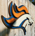 Denver Broncos modern logo displayed on a wooden fence