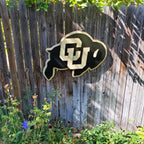 Wooden CU Buffs logo hanging on a wooden fence